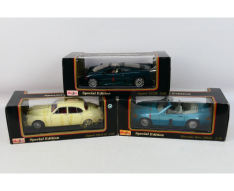 Maisto - Three boxed 1:18 scale diecast model cars from Maisto. Lot consists of Jaguar XJ220; Mercedes Benz 500SL; and a Jagu