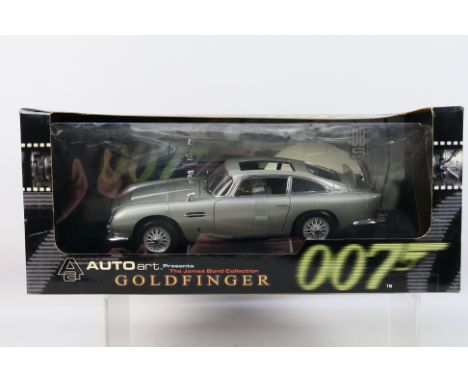 AutoArt - A boxed AutoArt #70021 1:18 scale 'Goldfinger' James Bond's Aston Martin DB5. The model appears to be in Mint condi