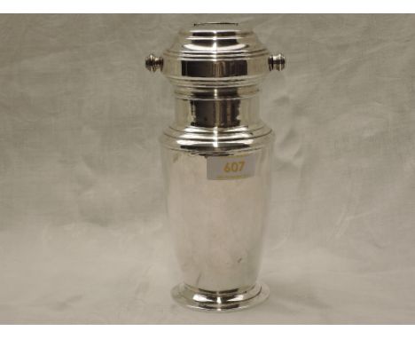 A silver plated Art Deco MIXIT cocktail shaker having rotating list of cocktail recipes in the lid, including Kicking Horse, 