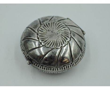 A white metal circular trinket box of oyster shell style having gilt interior and bearing marks to base, possibly Far Eastern