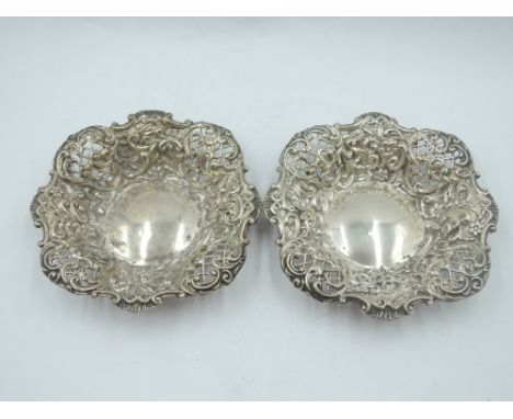 A pair of Edwardian silver trinket dishes having extensive pierced and repousse decoration, Birmingham 1901, Henry Matthews, 