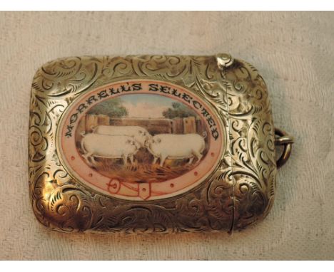 An Edwardian silver vesta having engraved scroll decoration with an enamelled panel to front depicting a trio of pigs, Morrel