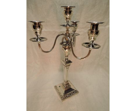 A large Edwardian silver four light candelabrum having a detachable top with trio of scroll branches and central light, all h
