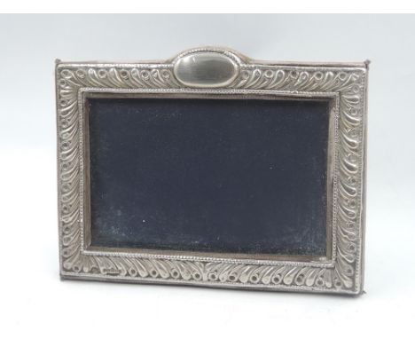 A silver photograph frame having blue velvet easel back, London 1991, Keyford Frames Ltd, approx 7' x 5'