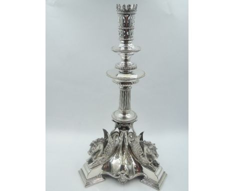 A Victorian Egyptian Revival style candle stick having crown style sconce above beaded drip pan to column stem to base having