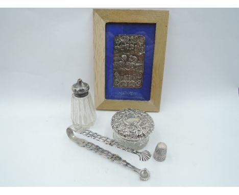 A small selection of HM silver including framed book cover having cherub decoration, glass dressing table pot having silver l