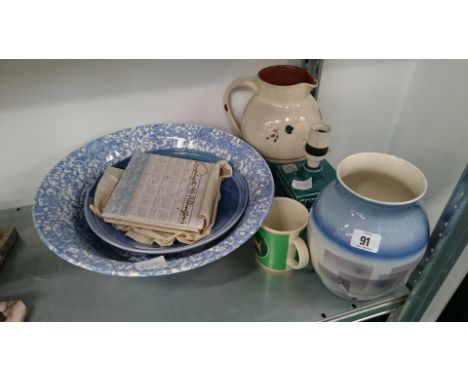 A quantity of various Poole Pottery items.