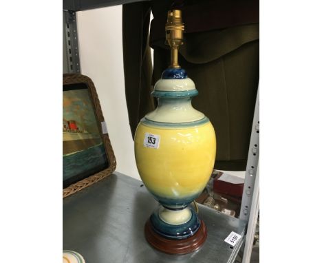 A William Moorcroft large table lamp decorated in a graduated yellow and blue glaze, circa 1930 on wooden base with fittings 