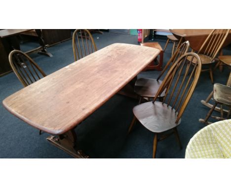 A set of four Ercol style stick back dining chairs, (kite mark and numerals to undersides).