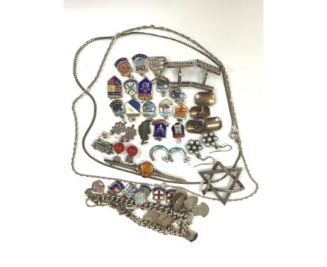 A bag containing a quantity of silver jewellery items including a charm bracelet with enamel charms, Jewish pendant, bar broo