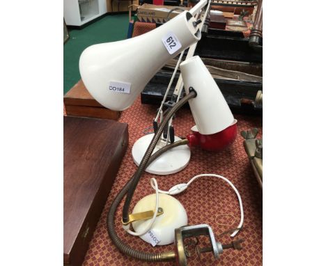 An angle poise desk lamp in white enamel, one other for screw on table and a desk model.