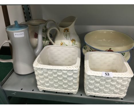 Nine various Poole Pottery items. 
