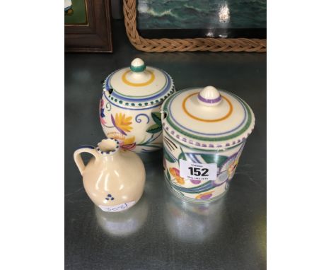 A Poole Pottery earthenware traditional preserve pot, decorated in the V design, painted by Nellie Bishton together with anot
