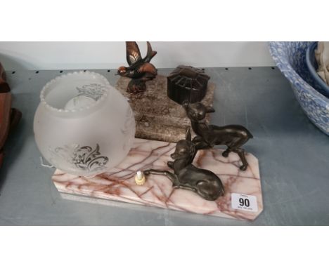 A 1930's metal mounted desk set with a bird and a similar table lamp decorated with a bird in flight.