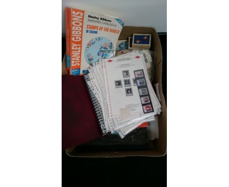 Stanley Gibbons stamp catalogues, a collection of First Day Covers, various odd stamps and playing cards.
