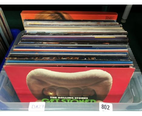 A large box of LP 33 RPM vinyl records to include Rolling Stones, Wings, John Lennon. VG/VG + Conditions.