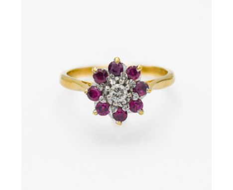 An 18ct yellow gold ruby and diamond 'Flower' design ring, size T.