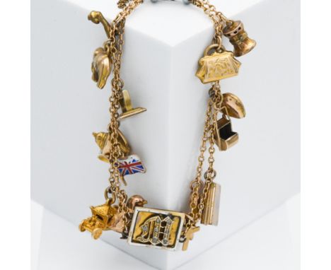 An antique 9ct yellow gold double chain charm bracelet set to a central square shaped panel with the letter 'M' set with old 