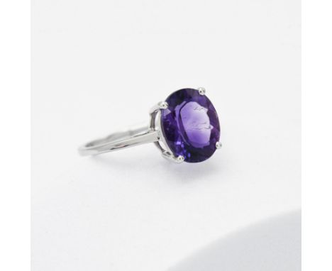 A 9ct white gold ring set with 3.25 carats of oval Moroccan Amethyst, 2.81gm (weighed with tag), size R to S, new with gift b