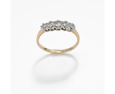 An 18ct yellow gold &amp; platinum five stone ring set with five round cut diamonds, 1.71gm, size L 1/2 to M.