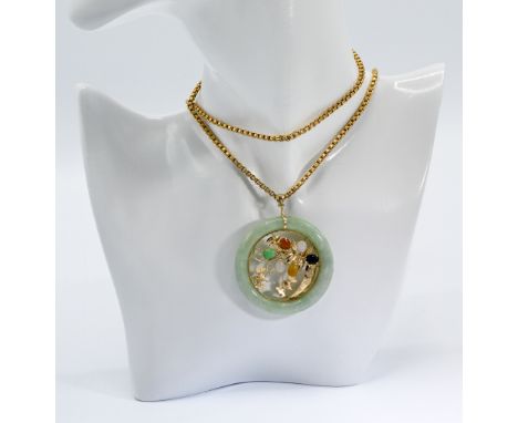 An 18ct yellow gold 28" fancy link box chain, 15.00gm, with a 14ct yellow gold round jade 'donut' pendant set centrally with 