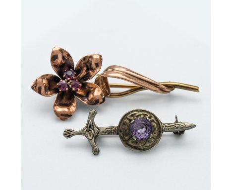 A gold and ruby? flower brooch (not hallmarked) together with another (2).