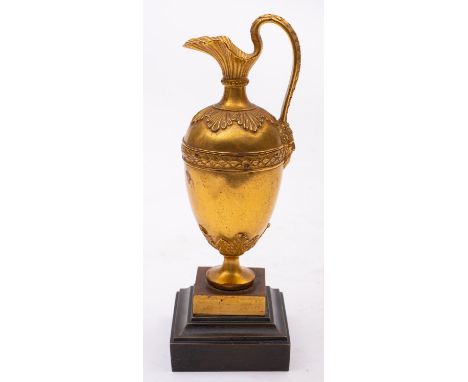 A Louis Philippe gilt bronze model of a ewer, circa 1840; of ovoid form with flared spout, foliate cast shoulder and serpenti