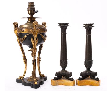 A pair of Louis Philippe bronze and marmo Siena mounted candlesticks, circa 1835; the sockets and foliate cast baluster shaft