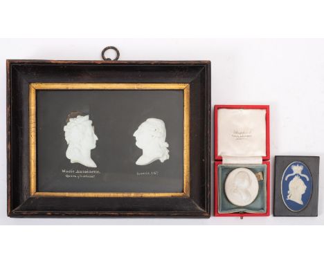 A pair of 19th century white biscuit portrait medallions of Marie Antoinette and Louis XVI, an oval blue and white jasper med