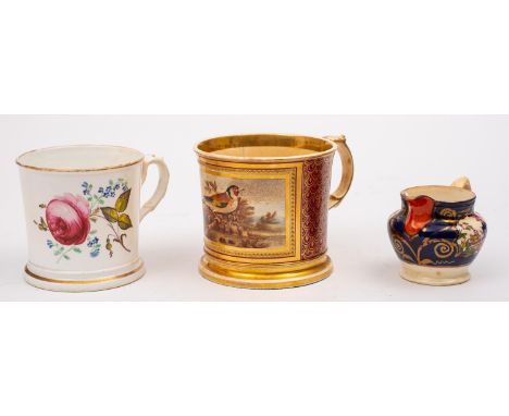 A Staffordshire porcelain mug, painted with flowers, together with a similar mug painted with a songbird in a landscape withi