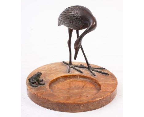 An Austrian bronze and onyx mounted vide poche, circa 1900; modelled with a crane and a frog beside a circular recess in the 