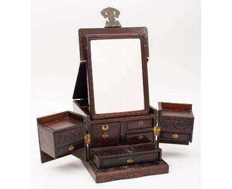 A Chinese hardwood travelling dressing box, late Qing Dynasty with brass mounts, locks and carrying handles, the interior wit