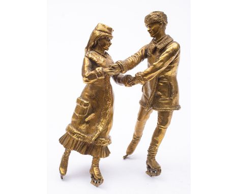 After Vasily Grachev (Russian 1831-1905), a gilt bronze group of a couple ice skating, late 19th century, portrayed in winter
