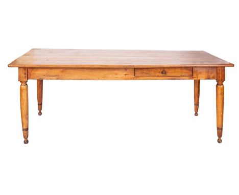 A French farmhouse table, probably fruitwood; early 19th century; with rectangular top, one long side with an off-centre draw