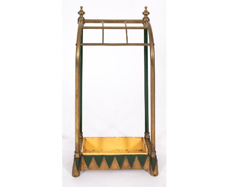 A brass and painted cast iron mounted stick stand in Aesthetic Movement style, circa 1900; the arching top with six square ap