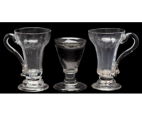 Two syllabub glasses and a firing glass, 18th/19th century the first with ribbed pan-topped bowls, one on folded foot, both w