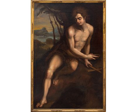 Manner of Merisi da Caravaggio (Italian, 1571-1610), 19th Century -Saint John the Baptist seated in a landscape with distant 