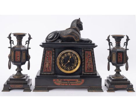 Henry Marc, Paris a black marble and bronze mid-Victorian Egyptian revival mantel clock garniture, the eight-day duration mov