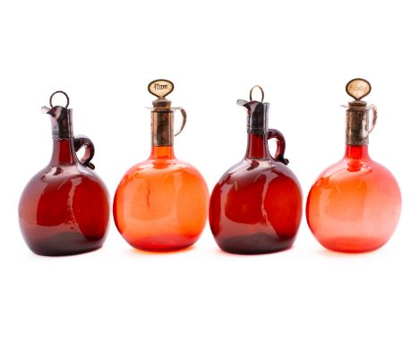 A pair of 19th century ruby glass flagon decanters and a pair of similar brown glass decanters with plated mounts and stopper