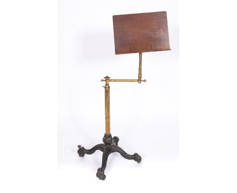 A Victorian cast iron and brass reading or music stand, circa 1870; fully adjustable in angle, pitch and height; with mahogan