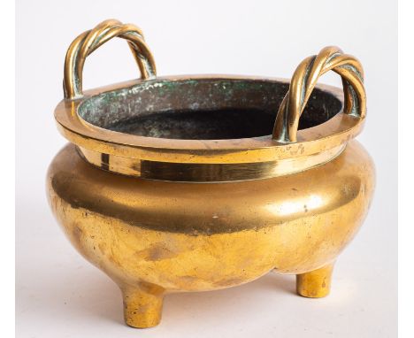 A large Chinese polished bronze tripod censer of compressed globular form with upright rope-twist handles, apocryphal six-cha