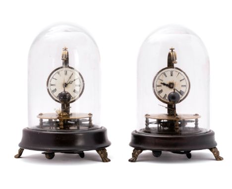 Horolovar, a pair of German Briggs rotary pendulum clocks each having a round white enamel dial with black Roman numerals, bl