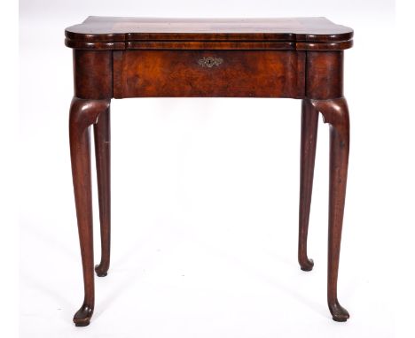 A George II walnut and burr walnut card table, mid 18th century and later; the hinged top with eared front corners, opening t