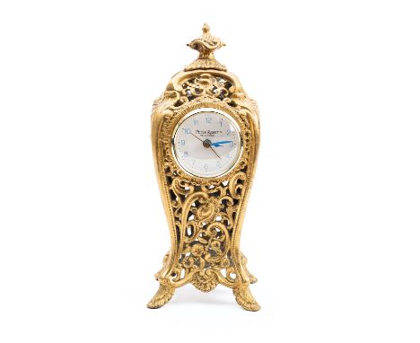 A Peter Rabbit mantel clock having an ormolu cast-brass shaped case, the round dial signed Peter Rabbit, Wedgewood, height 27