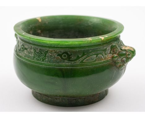 A Chinese jade censer, of apple green colour and bombe form with grotesque mask handles and a carved thunder key band with ta