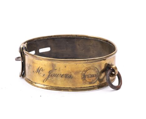 An early 19th Century brass dog collar with rolled rim, ring attachment and three adjustment slots, inscribed  'Mr Towers, No