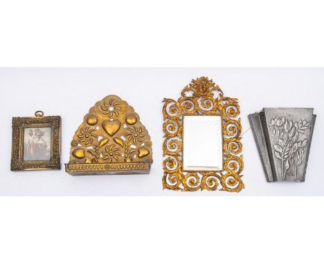 A gilt metal framed wall mirror in a late 17th century-style, circa 1900; with mask cresting above the openwork scrolling fol