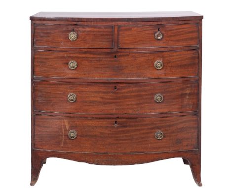 A Regency mahogany bowfront chest of drawers, circa 1815; the two short and three graduated long drawers all with brass ring 