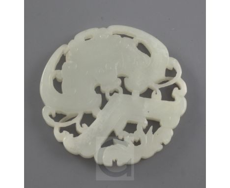 A Chinese white jade plaque, late 19th / early 20th century, carved and pierced with a bat supporting a chime and lotus flowe