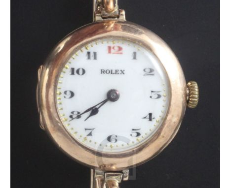 A lady's early 20th century 9ct gold Rolex manual wind wrist watch, with Arabic dial and red twelve, case import marked for 1